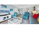 Open concept living and dining area with seating at 1330 Glen Oaks E Dr # 268D, Sarasota, FL 34232