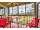 Relaxing screened porch with patio furniture and view at 1330 Glen Oaks E Dr # 268D, Sarasota, FL 34232