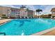 Inviting community swimming pool with lounge chairs at 1330 Glen Oaks E Dr # 268D, Sarasota, FL 34232