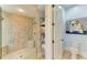 Spa-like bathroom with glass shower, tile, and built-in shelving at 13605 Legends Walk Ter, Lakewood Ranch, FL 34202