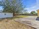 Large backyard featuring a storage shed, offering plenty of space for outdoor activities at 1382 Ronald St, North Port, FL 34286