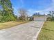 Charming single-story home with a spacious front yard and a long private driveway at 1382 Ronald St, North Port, FL 34286