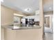 Updated kitchen featuring stainless steel appliances, white cabinetry, and a breakfast bar at 1382 Ronald St, North Port, FL 34286