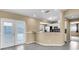 The kitchen has stainless steel appliances, a breakfast bar, and easy access to the backyard at 1382 Ronald St, North Port, FL 34286