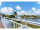 Waterfront balcony with white railing and scenic views at 1389 Tangier Way, Sarasota, FL 34239