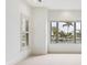 Bedroom with large windows offering water views at 1389 Tangier Way, Sarasota, FL 34239