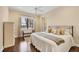 Comfortable bedroom with hardwood floors and water views at 1389 Tangier Way, Sarasota, FL 34239