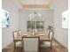 Elegant dining room featuring a large wooden table and natural light at 1389 Tangier Way, Sarasota, FL 34239