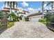 Grand estate home with gated entry and expansive driveway at 1389 Tangier Way, Sarasota, FL 34239