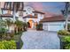 Mediterranean-style home with tile roof and gated entry at 1389 Tangier Way, Sarasota, FL 34239