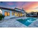 Stunning home exterior with pool and beautiful sunset view at 1389 Tangier Way, Sarasota, FL 34239