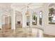 Bright living room with high ceilings, fireplace, and water views at 1389 Tangier Way, Sarasota, FL 34239