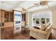 Spacious living room with hardwood floors, built-in shelving, and water views at 1389 Tangier Way, Sarasota, FL 34239