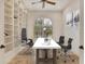 Home office with built-in shelving and arch window at 1389 Tangier Way, Sarasota, FL 34239