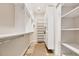 Large walk-in closet with ample shelving and hanging space at 1389 Tangier Way, Sarasota, FL 34239