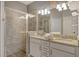 Bathroom with double vanity and a large shower at 15910 Clear Skies Pl, Bradenton, FL 34211