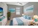 Main bedroom with a king-size bed and ocean-themed decor at 15910 Clear Skies Pl, Bradenton, FL 34211