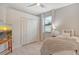 Bright bedroom with double doors and cozy bed at 15910 Clear Skies Pl, Bradenton, FL 34211