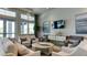 Relaxing community room boasts comfortable seating, large TV, and stylish decor at 15910 Clear Skies Pl, Bradenton, FL 34211