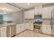 Modern kitchen with granite countertops and stainless steel appliances at 15910 Clear Skies Pl, Bradenton, FL 34211