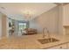 Modern kitchen with island and view of living area at 15910 Clear Skies Pl, Bradenton, FL 34211