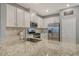 Modern kitchen with granite countertops and stainless steel appliances at 15910 Clear Skies Pl, Bradenton, FL 34211