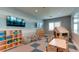 playroom with a playhouse, toys, and TV at 15910 Clear Skies Pl, Bradenton, FL 34211