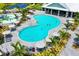 Freeform pool with surrounding lounge chairs at 15910 Clear Skies Pl, Bradenton, FL 34211