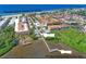 Aerial view highlighting beach access, pool, and fishing dock at 1603 Gulf N Dr # 27, Bradenton Beach, FL 34217
