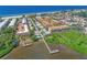 Aerial perspective showcasing community, waterfront, and beach at 1603 Gulf N Dr # 27, Bradenton Beach, FL 34217