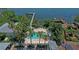 Aerial view showing community pool, dock, and waterfront location at 1603 Gulf N Dr # 27, Bradenton Beach, FL 34217