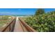 Wooden boardwalk leads to a sandy beach at 1603 Gulf N Dr # 27, Bradenton Beach, FL 34217