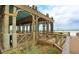 Beachfront gazebo with seating, perfect for relaxing and enjoying ocean views at 1603 Gulf N Dr # 27, Bradenton Beach, FL 34217