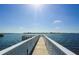 White wooden dock extending over calm water at 1603 Gulf N Dr # 27, Bradenton Beach, FL 34217