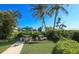 Lush patio with picnic tables and umbrellas at 1603 Gulf N Dr # 27, Bradenton Beach, FL 34217