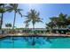 Inviting swimming pool with lounge chairs at 1603 Gulf N Dr # 27, Bradenton Beach, FL 34217