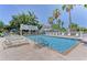 Inviting community pool with lounge chairs and gazebo at 1603 Gulf N Dr # 27, Bradenton Beach, FL 34217