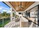 Relaxing balcony overlooking the water with outdoor seating at 1707 Palma Sola Blvd, Bradenton, FL 34209