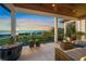 Expansive balcony showcasing a sunset over the water at 1707 Palma Sola Blvd, Bradenton, FL 34209