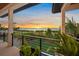 Relaxing balcony with sunset view and lush landscaping at 1707 Palma Sola Blvd, Bradenton, FL 34209