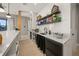Modern bar area with white cabinets and quartz counters at 1707 Palma Sola Blvd, Bradenton, FL 34209