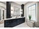 Bathroom features a stylish dark vanity and modern fixtures at 1707 Palma Sola Blvd, Bradenton, FL 34209