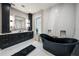 Elegant bathroom with dark vanity, soaking tub, and marble accents at 1707 Palma Sola Blvd, Bradenton, FL 34209