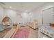 Charming Bedroom with crib, rocker, and play area at 1707 Palma Sola Blvd, Bradenton, FL 34209