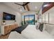 Main bedroom with water views, large TV, and spacious layout at 1707 Palma Sola Blvd, Bradenton, FL 34209