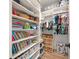 Organized closet with clothing, toys, and books at 1707 Palma Sola Blvd, Bradenton, FL 34209