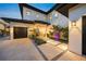 Elegant entryway with landscaping and lighting at 1707 Palma Sola Blvd, Bradenton, FL 34209