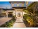 Modern home exterior with landscaping at night at 1707 Palma Sola Blvd, Bradenton, FL 34209