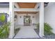 Inviting front entrance with modern door and landscaping at 1707 Palma Sola Blvd, Bradenton, FL 34209