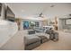 Spacious Gathering room with sectional sofa and wet bar at 1707 Palma Sola Blvd, Bradenton, FL 34209